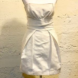 Off white strapless summer dress with pockets.